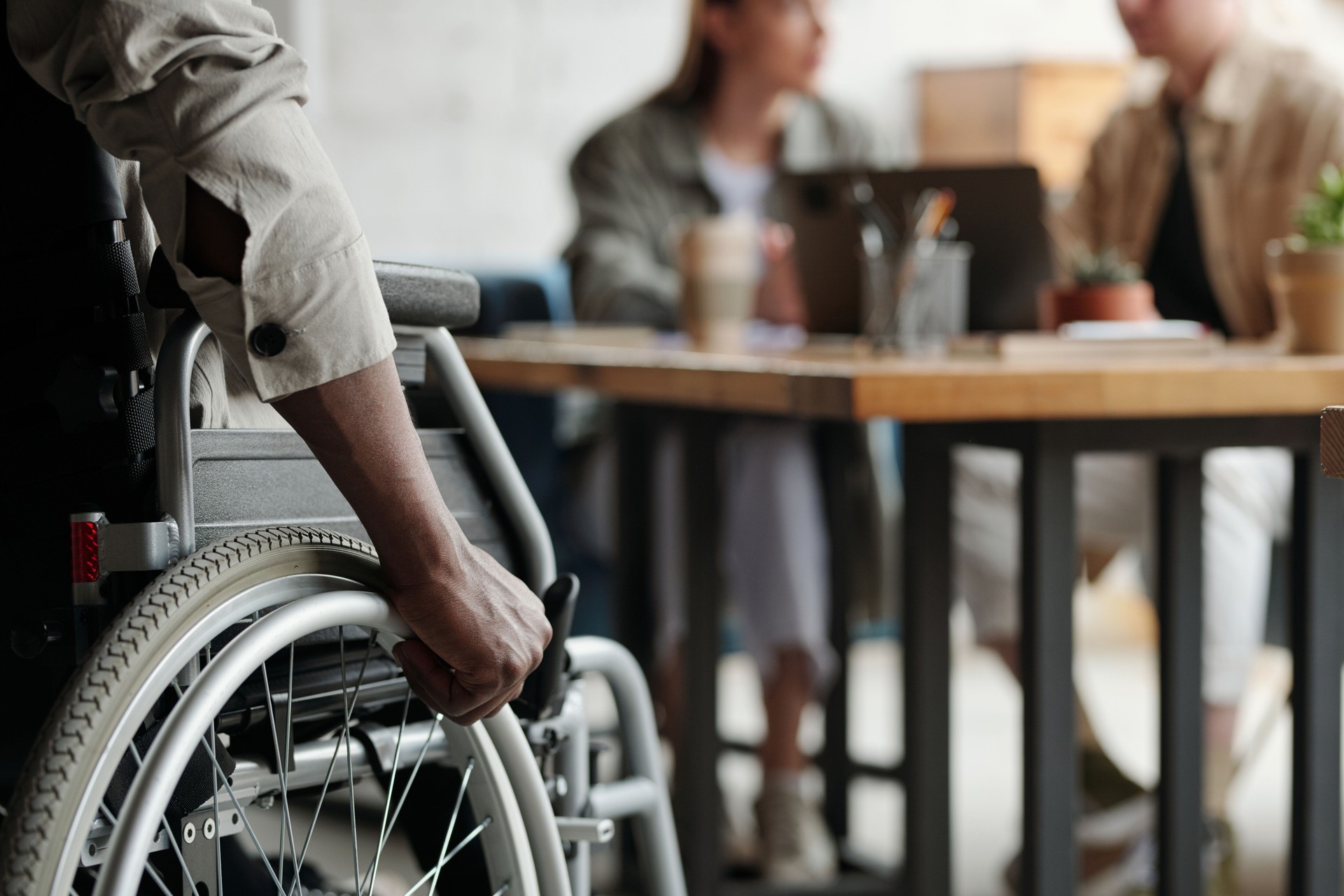 Part of young African American male employee with disability